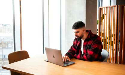Client deadlines vs finals a study plan student freelancer working on a laptop at a study table.jpg